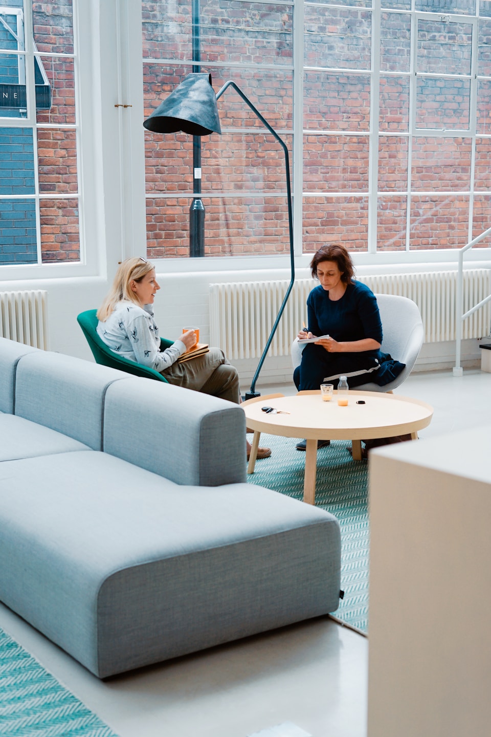 Investors in discussion at a modern lounge